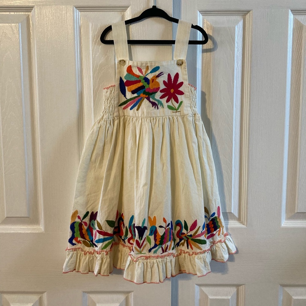 Nativa Girls Cream Color Sun Dress With Embroidered Animals & Ruffle Hemline